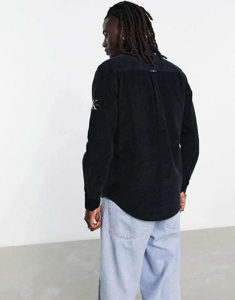 商品Calvin Klein|Calvin Klein Jeans monologo badge corduroy shirt in black,价格¥486,第2张图片详细描述