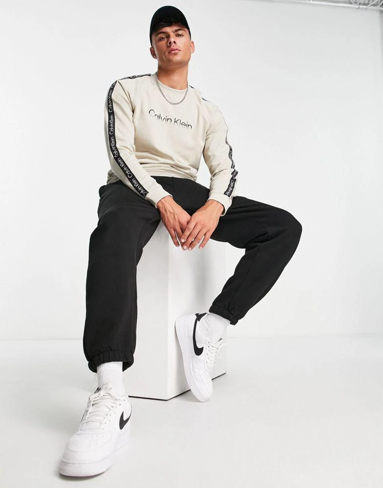 商品Calvin Klein|Calvin Klein Performance chest logo sweatshirt in beige,价格¥755,第2张图片详细描述