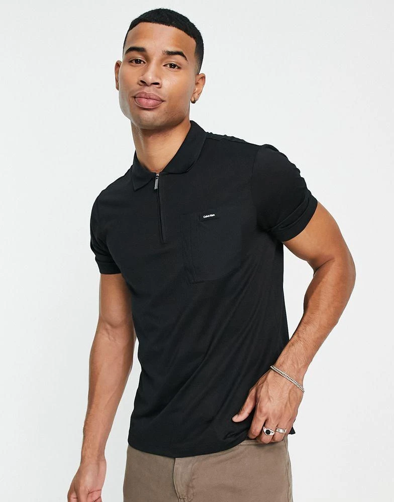 商品Calvin Klein|Calvin Klein logo mix media repreve zip neck polo in black,价格¥543,第1张图片