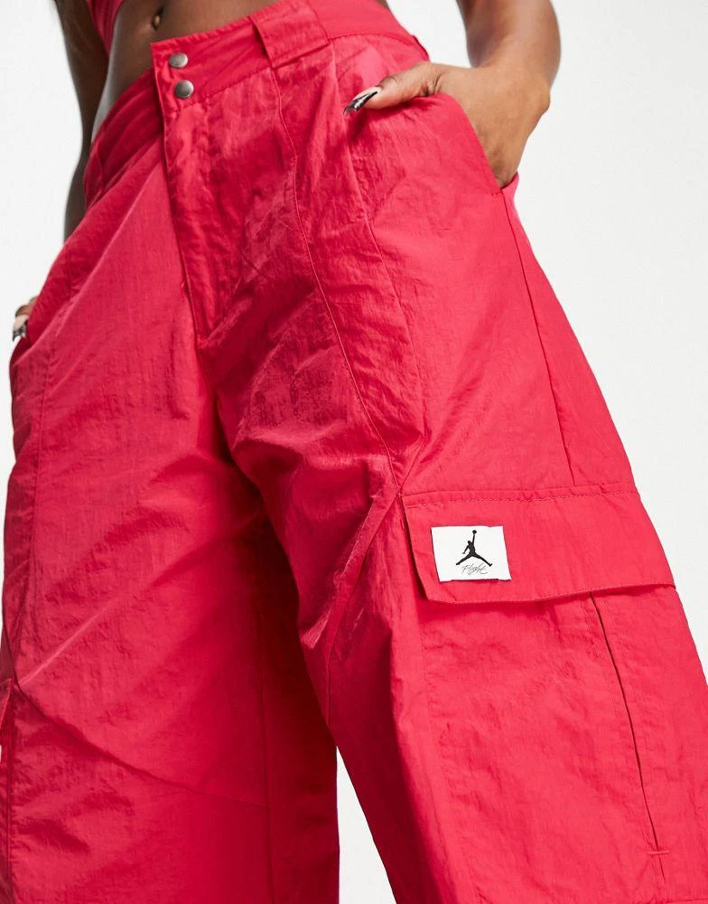 商品Jordan|Jordan essential cargo parachute trousers in hibiscus red,价格¥502,第3张图片详细描述