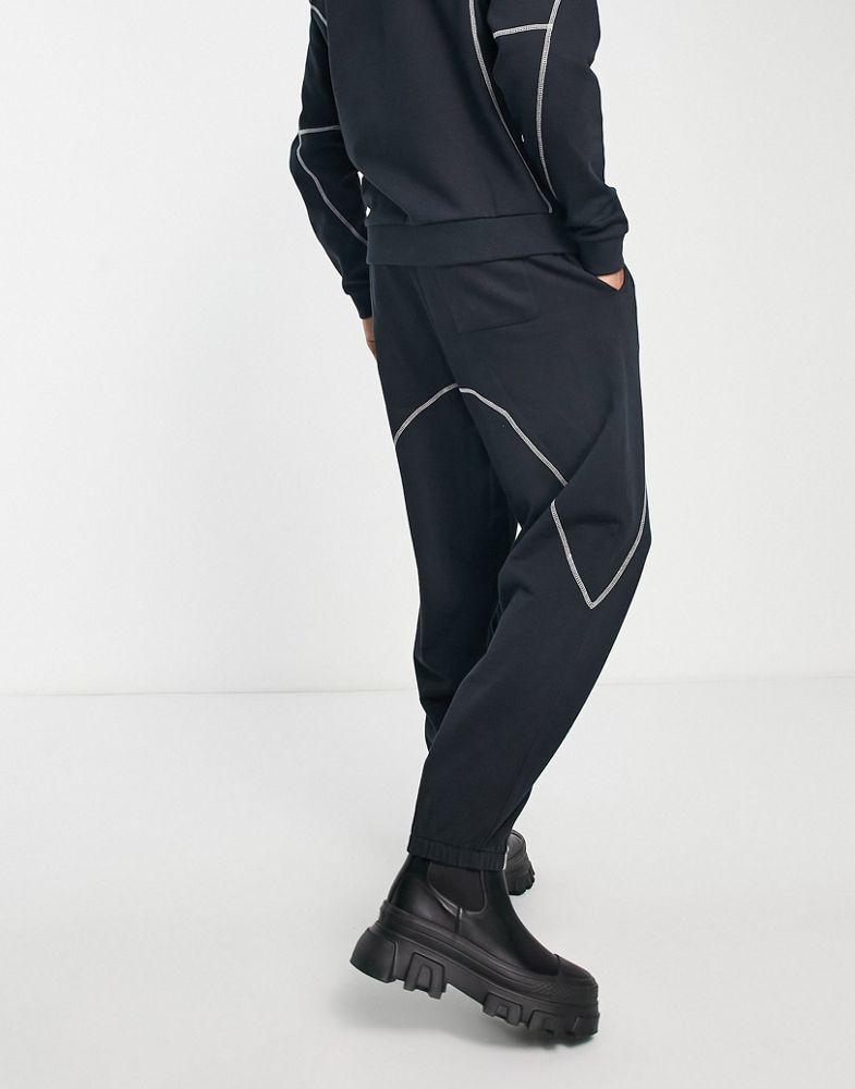 ASOS DESIGN co-ord relaxed joggers in black with tattoo print and stitching detail商品第2张图片规格展示