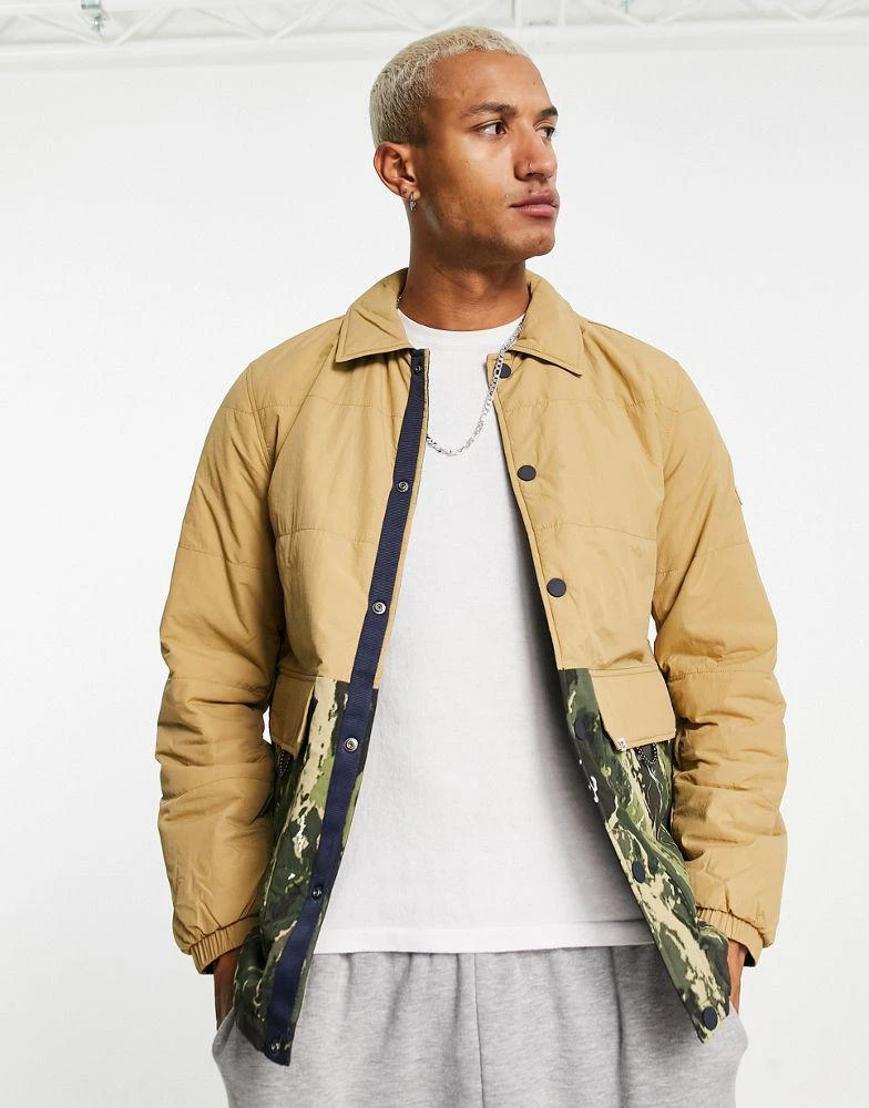 商品Tommy Hilfiger|Tommy Jeans plain and camo print reversible coach jacket in navy/beige camo print,价格¥728,第2张图片详细描述