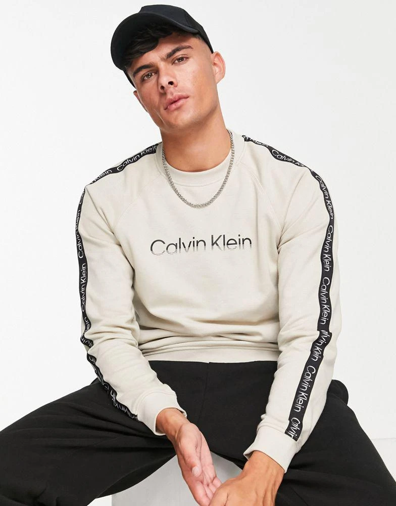 商品Calvin Klein|Calvin Klein Performance chest logo sweatshirt in beige,价格¥755,第1张图片