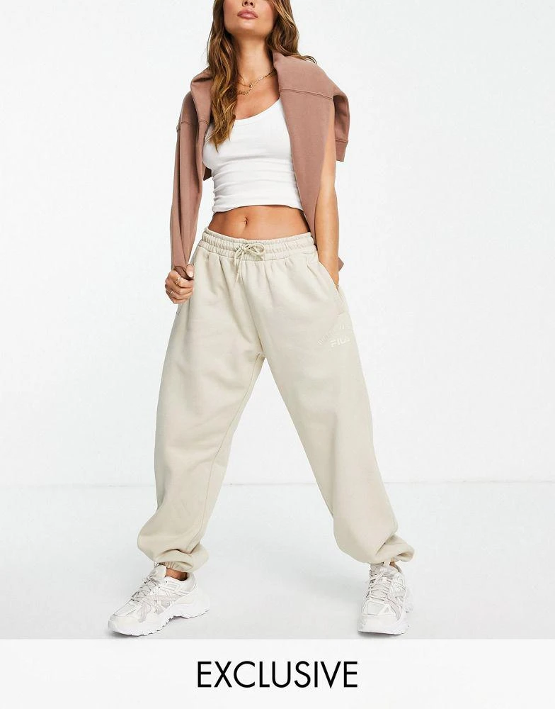 商品Fila|Fila oversized joggers with tonal branding in ecru,价格¥256,第1张图片