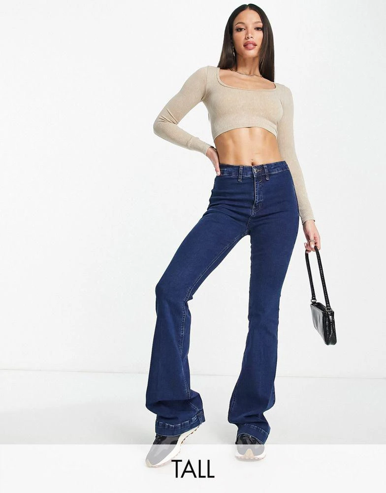 商品River Island Tall|River Island Tall mid rise pocketless flare jean in medium blue,价格¥195,第1张图片