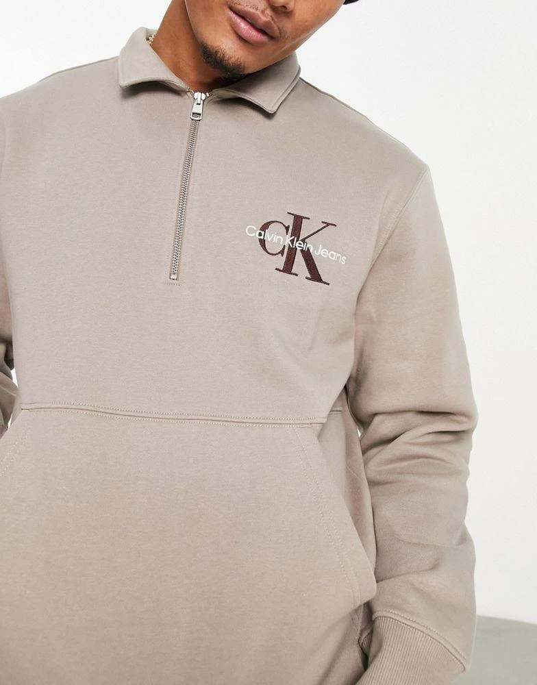 商品Calvin Klein|Calvin Klein Jeans monologo quarter zip rugby sweatshirt in taupe,价格¥573,第4张图片详细描述