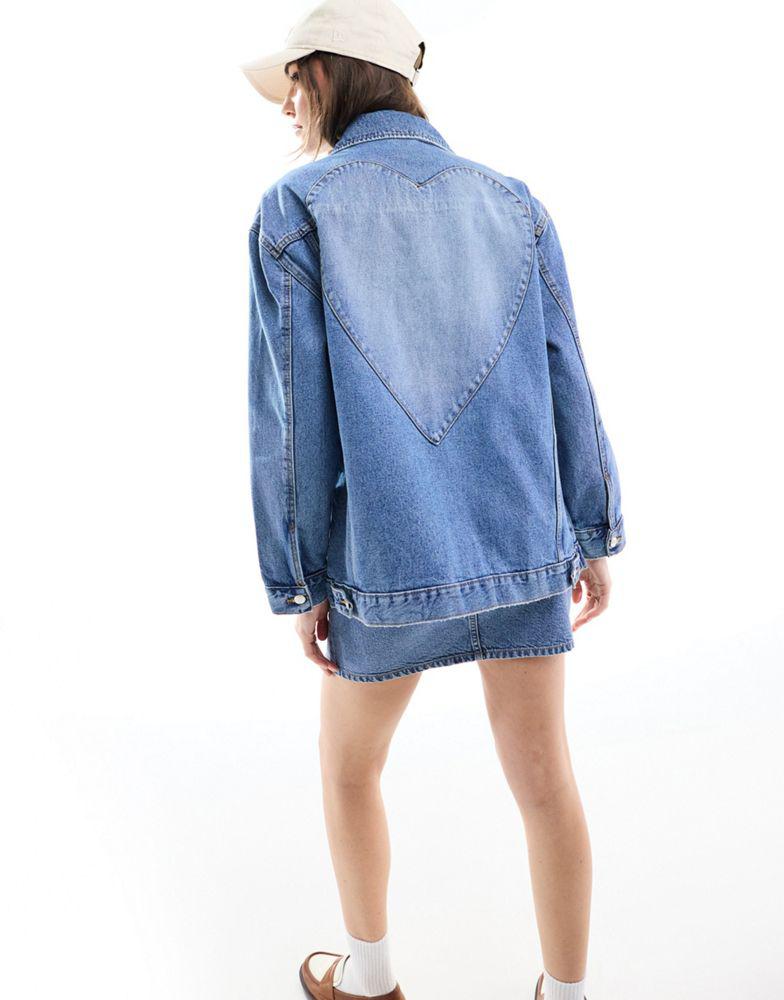 Miss Selfridge | Miss Selfridge oversized heart detail denim jacket in light blue wash 481.17元 商品图片