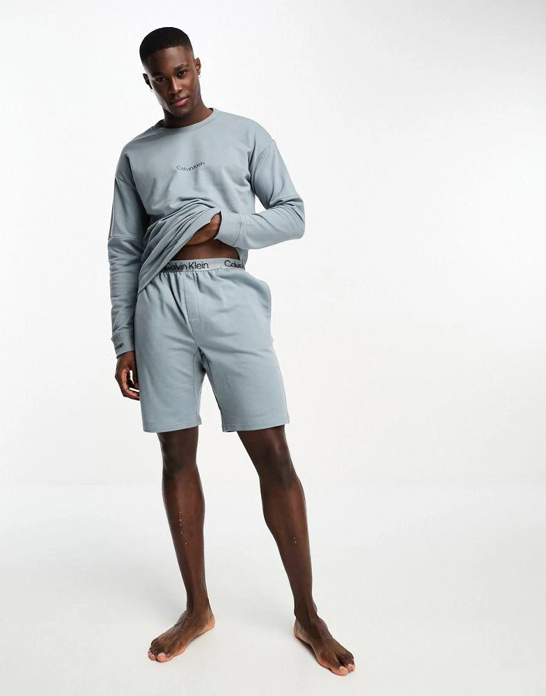 商品Calvin Klein|Calvin Klein sleep sweatshirt in blue,价格¥374,第1张图片