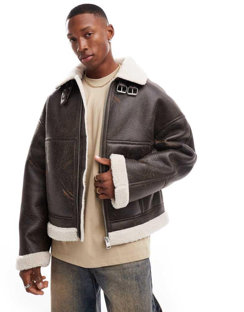 Shop Bershka faux leather washed jacket with shearling in brown on