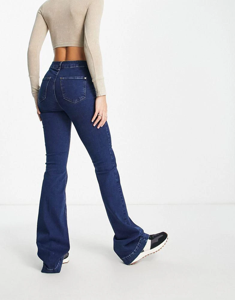 商品River Island Tall|River Island Tall mid rise pocketless flare jean in medium blue,价格¥195,第2张图片详细描述