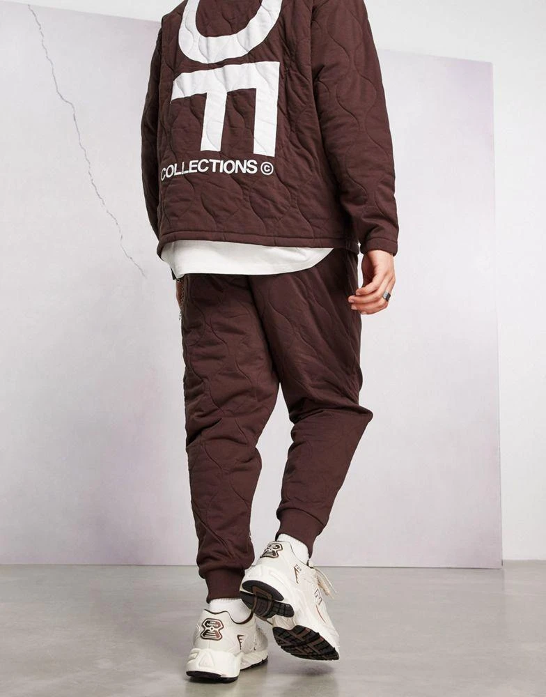 商品ASOS|ASOS Dark Future co-ord relaxed joggers with onion quilting and logo print in brown,价格¥167,第2张图片详细描述