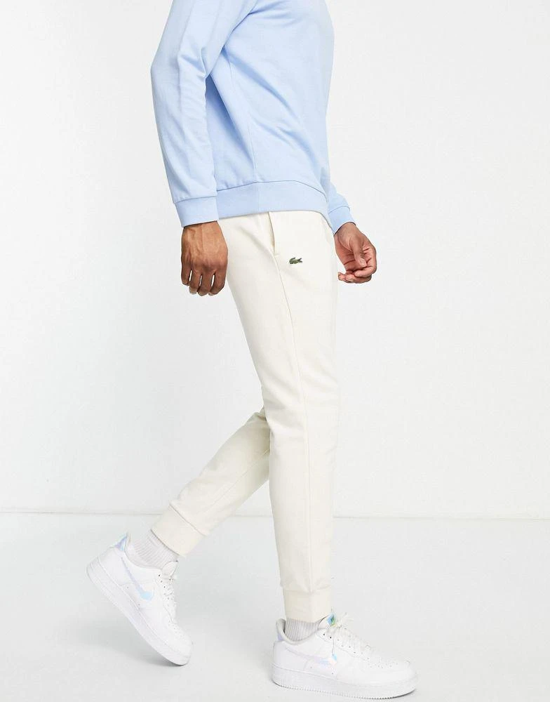 商品Lacoste|Lacoste fleece joggers in off white,价格¥494,第1张图片