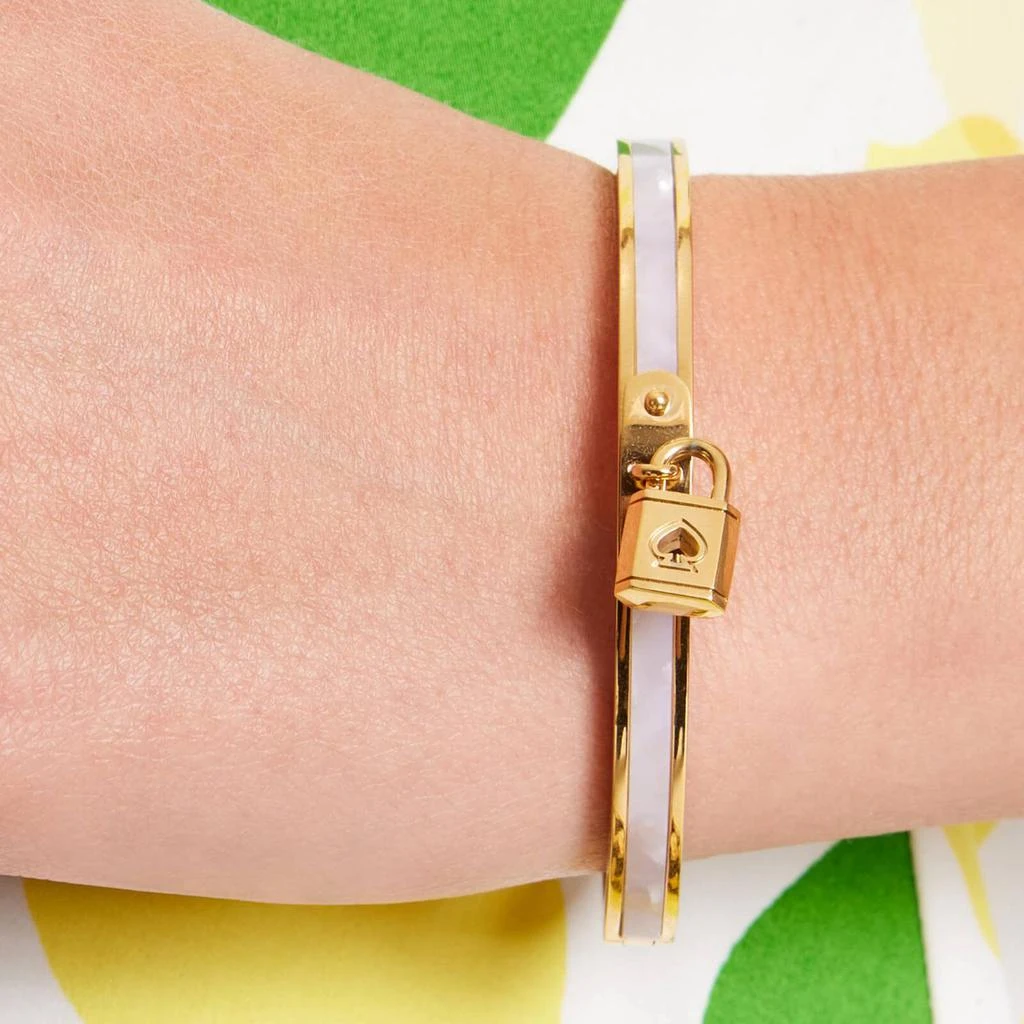 商品Kate Spade|Kate Spade New York Lock & Spade Gold-Plated Charm Bangle,价格¥588,第2张图片详细描述