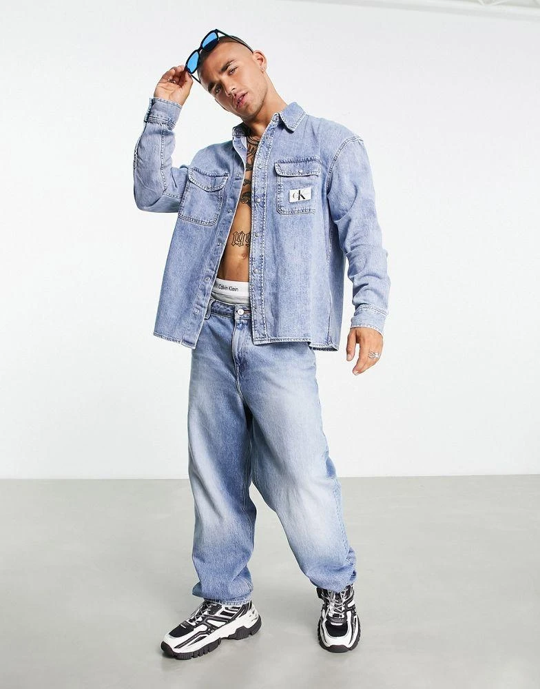 商品Calvin Klein|Calvin Klein Jeans oversized denim shirt in light wash,价格¥814,第4张图片详细描述
