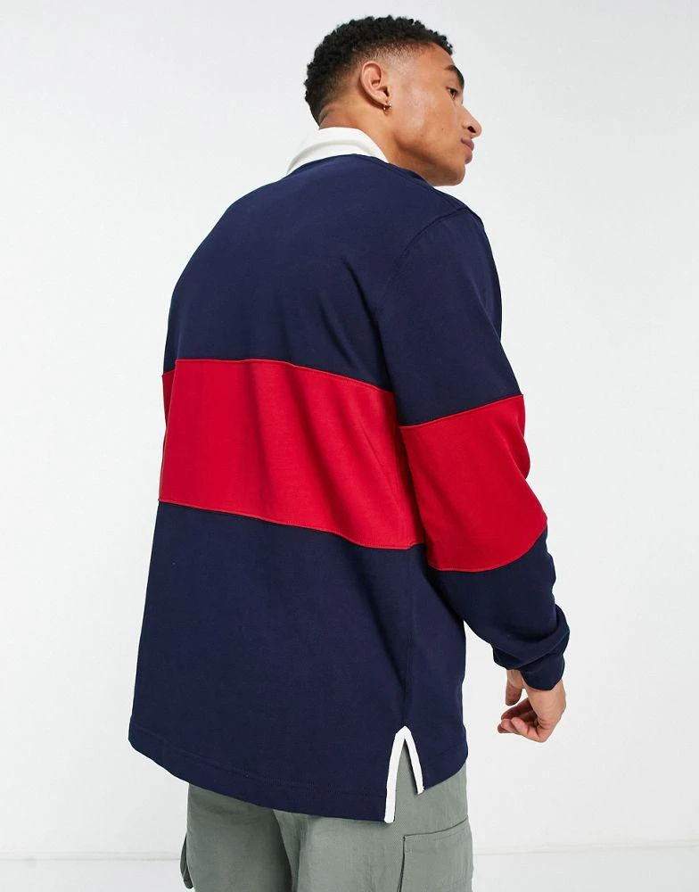 商品Lacoste|Lacoste striped rugby polo in navy/red,价格¥779,第2张图片详细描述