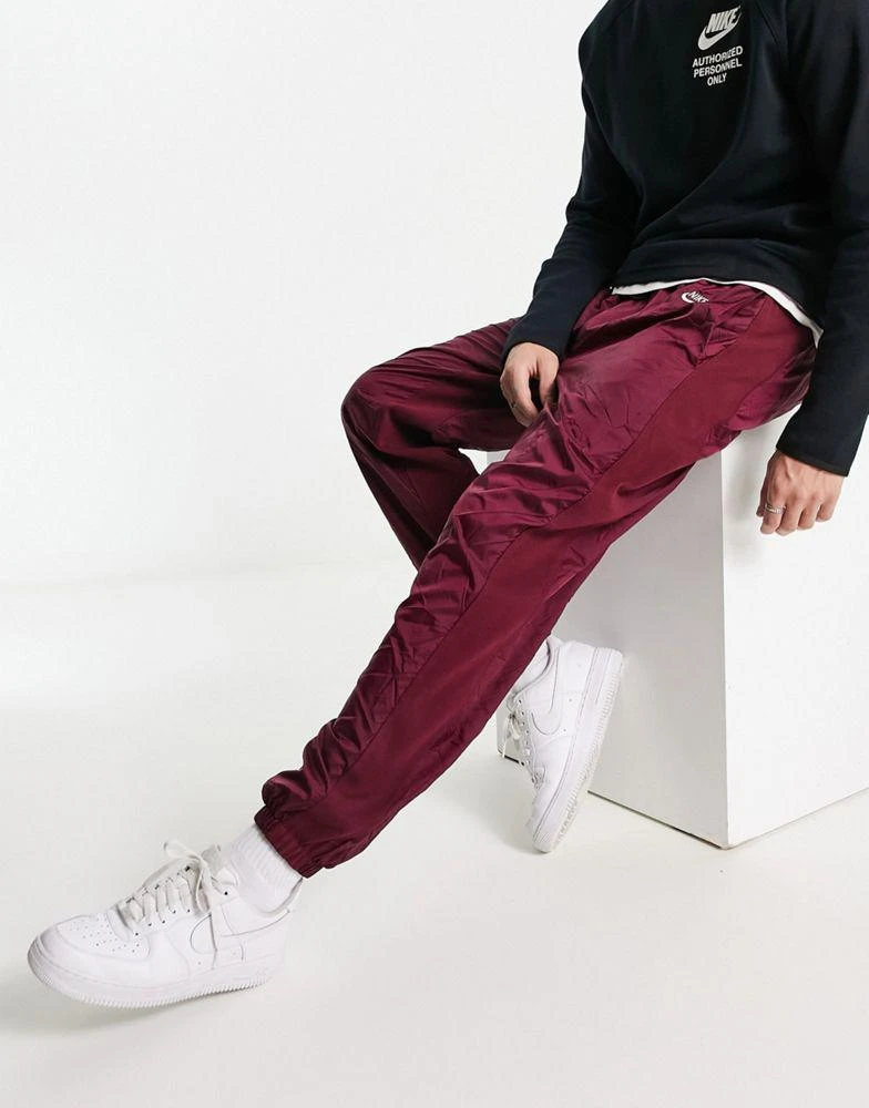 商品NIKE|Nike Circa Premium winter textured casual trousers dark beetroot red,价格¥493,第1张图片