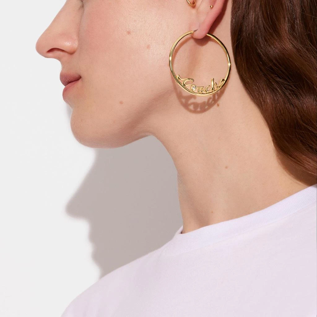 商品Coach|Logo Script Hoop Earrings,价格¥342,第2张图片详细描述