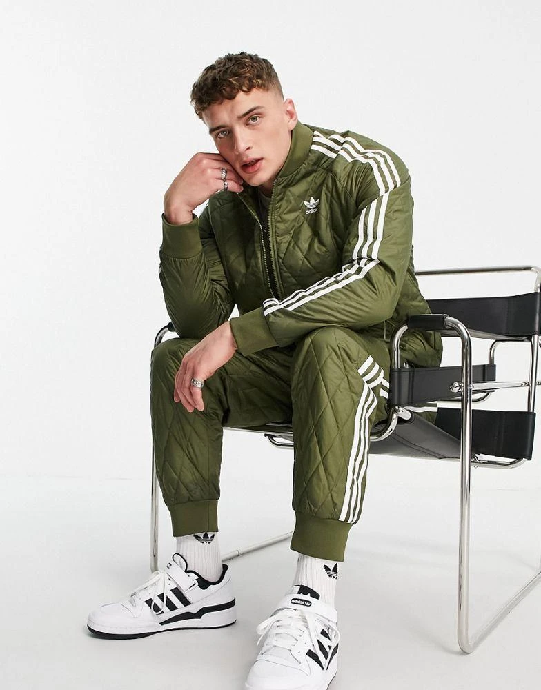 商品Adidas|adidas Originals adicolor three stripe quilted track pants in khaki,价格¥261,第1张图片