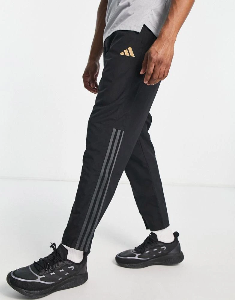 商品Adidas|adidas Football Germany World Cup 2022 pre-match 3 stripe joggers in black,价格¥328,第1张图片