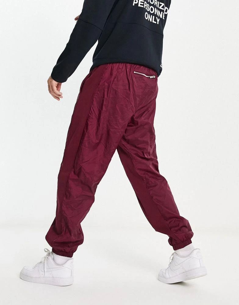 商品NIKE|Nike Circa Premium winter textured casual trousers dark beetroot red,价格¥493,第2张图片详细描述