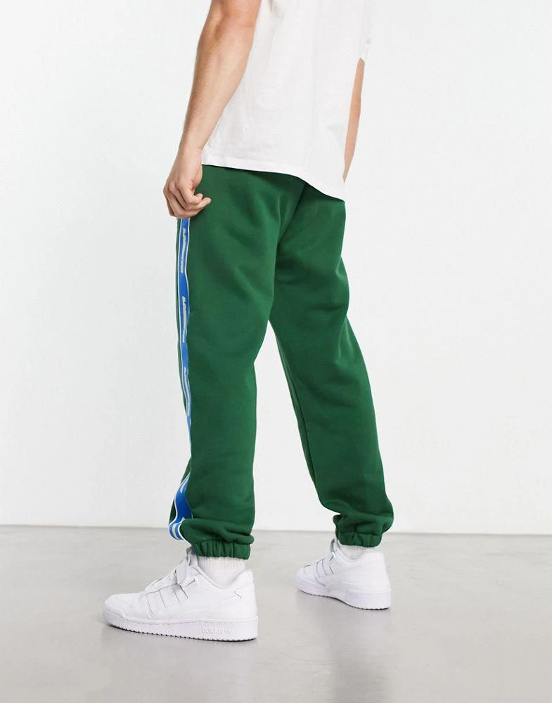 商品Lacoste|Lacoste Holiday large logo joggers in white,价格¥701,第4张图片详细描述