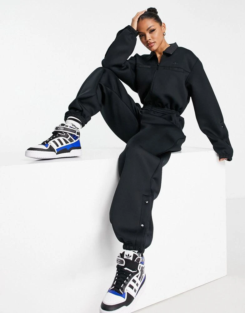 商品Adidas|adidas Originals Mountain Explorer funnel neck jumpsuit in black,价格¥1196,第1张图片