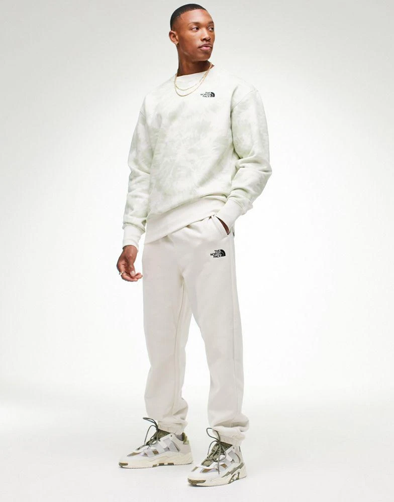 商品The North Face|The North Face Oversized Essential joggers in cream Exclusive at ASOS,价格¥360,第1张图片