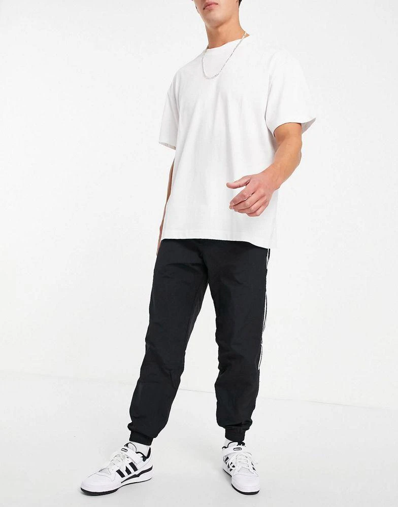 商品Adidas|adidas Originals adicolor lock up joggers in black,价格¥602,第2张图片详细描述