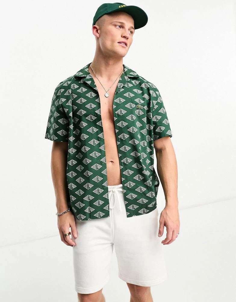商品Lacoste|Lacoste relaxed fit short sleeve shirt in dark green with all over print,价格¥1235,第1张图片