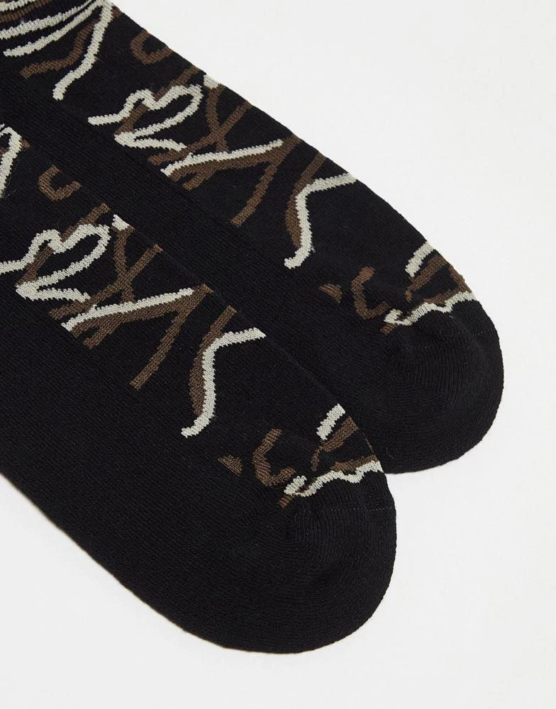 商品ASOS|ASOS DESIGN sports socks in black with camo line design,价格¥38,第2张图片详细描述