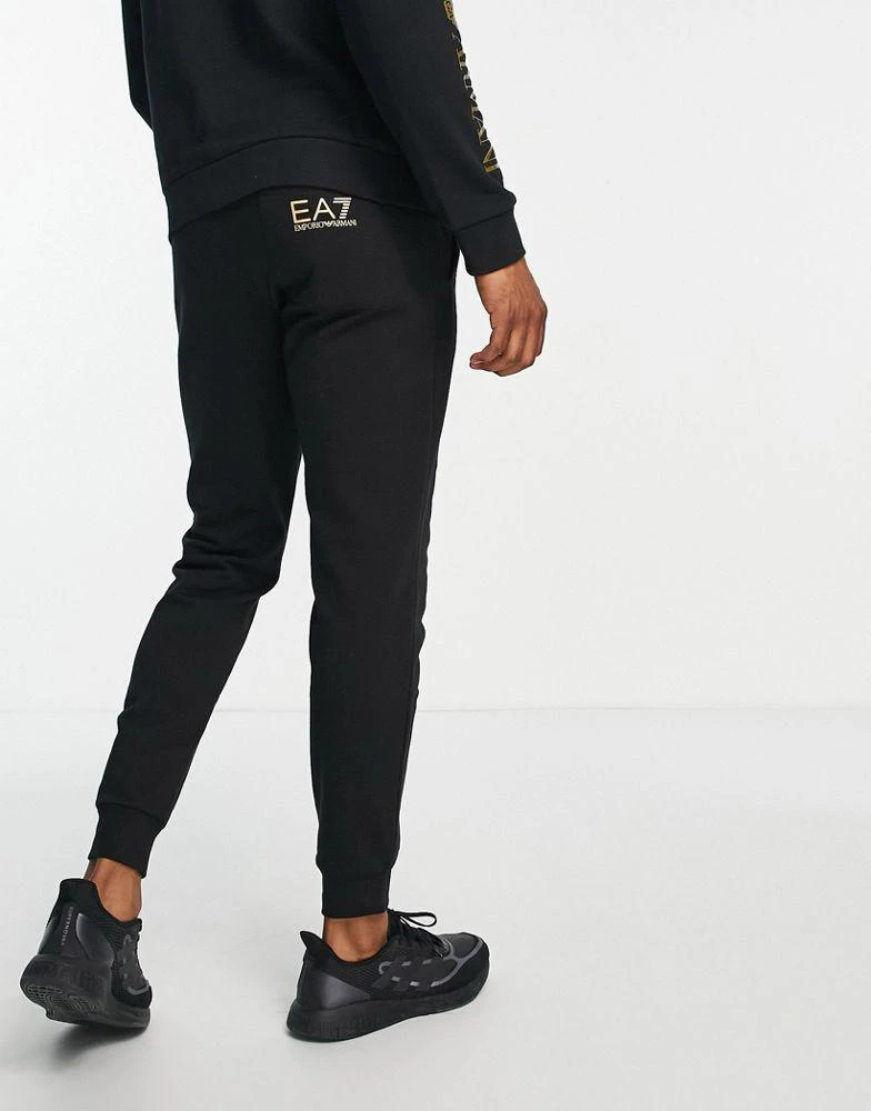 商品EA7|Armani EA7 large gold side logo joggers in black,价格¥512,第2张图片详细描述