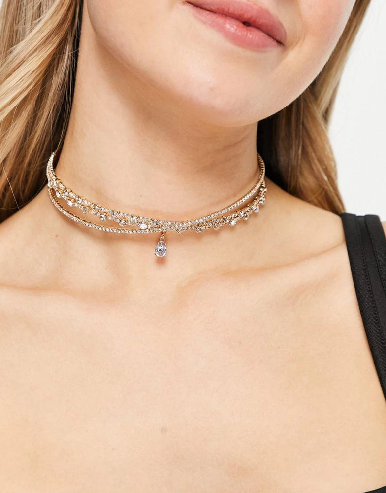 商品ASOS|ASOS DESIGN choker necklace with crystal cross over design and crystal pendant in gold tone,价格¥109,第1张图片