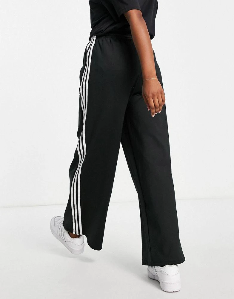 商品Adidas|adidas Originals adicolour three stripe logo relaxed fit track pants in black,价格¥363,第2张图片详细描述