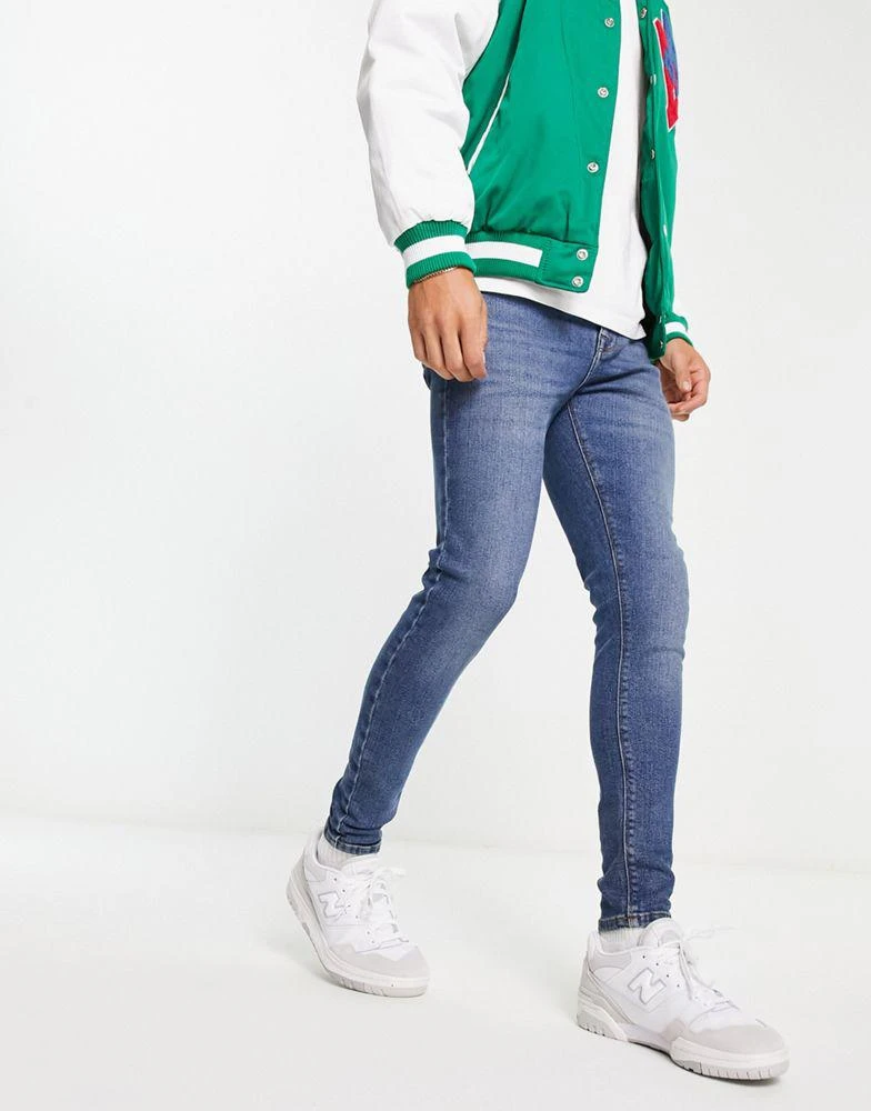 商品ASOS|ASOS DESIGN power stretch jeans in mid wash blue,价格¥174,第4张图片详细描述