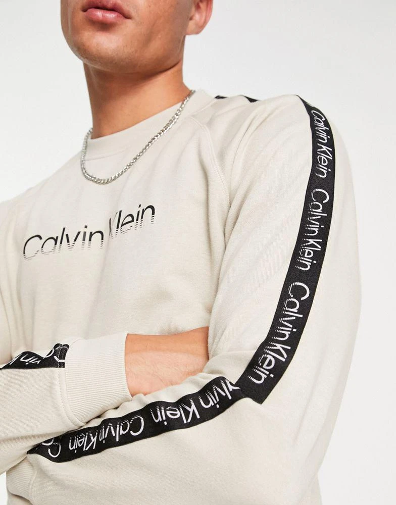 商品Calvin Klein|Calvin Klein Performance chest logo sweatshirt in beige,价格¥755,第4张图片详细描述