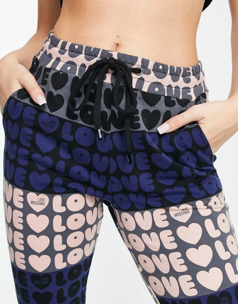 商品Love Moschino|Love Moschino LoveLove logo joggers in pink multi,价格¥471,第2张图片详细描述