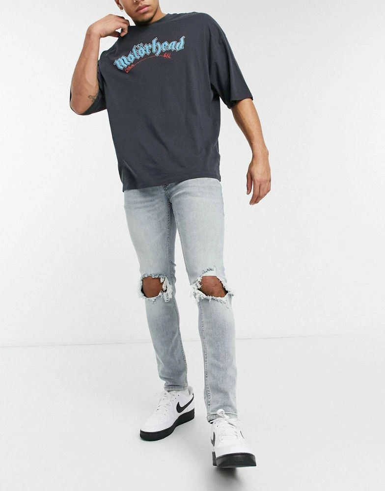 商品Topman|Topman skinny jeans with blow out knee rips in light wash blue,价格¥131,第1张图片