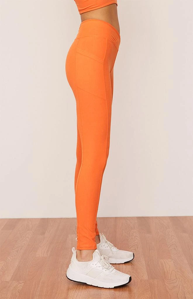 商品Wolven|Eco Tangerine Ruched Crossover Leggings,价格¥725,第2张图片详细描述