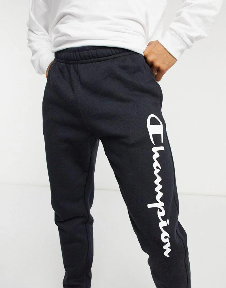 商品CHAMPION|Champion large logo tracksuit bottoms in black,价格¥354,第3张图片详细描述