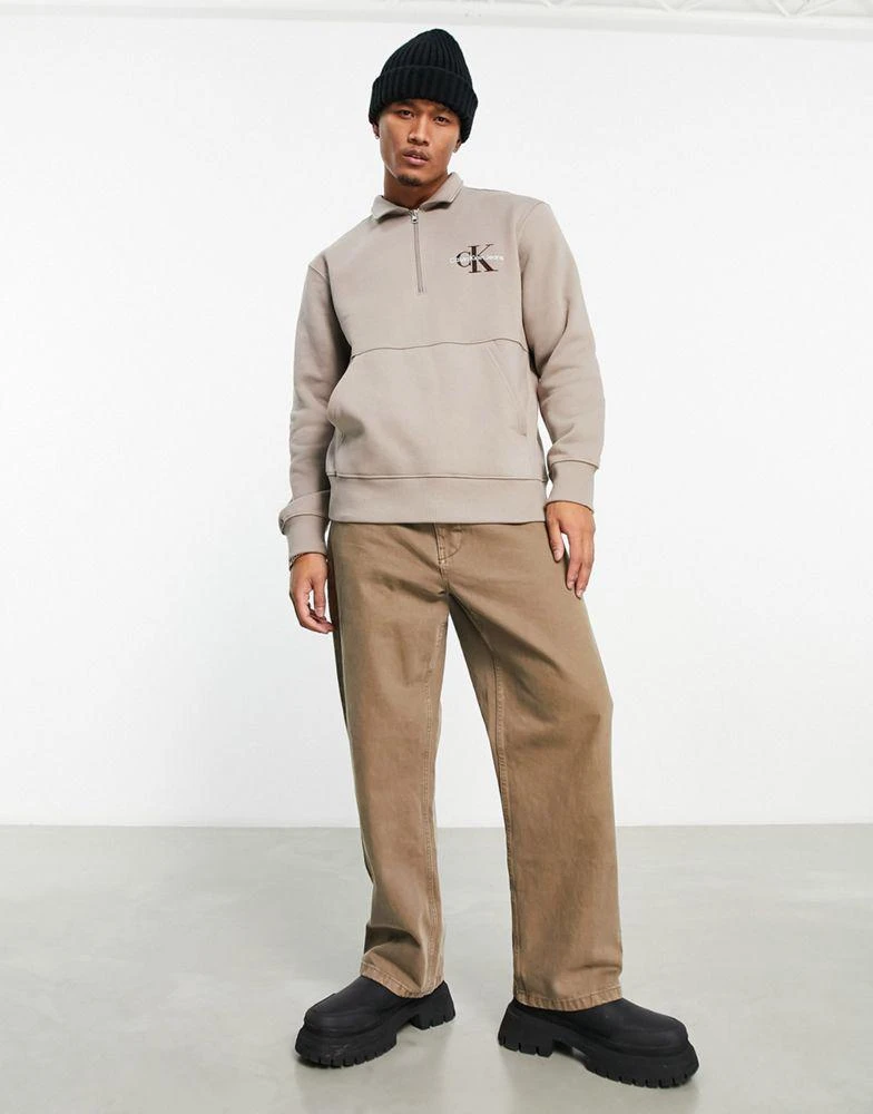 商品Calvin Klein|Calvin Klein Jeans monologo quarter zip rugby sweatshirt in taupe,价格¥573,第3张图片详细描述
