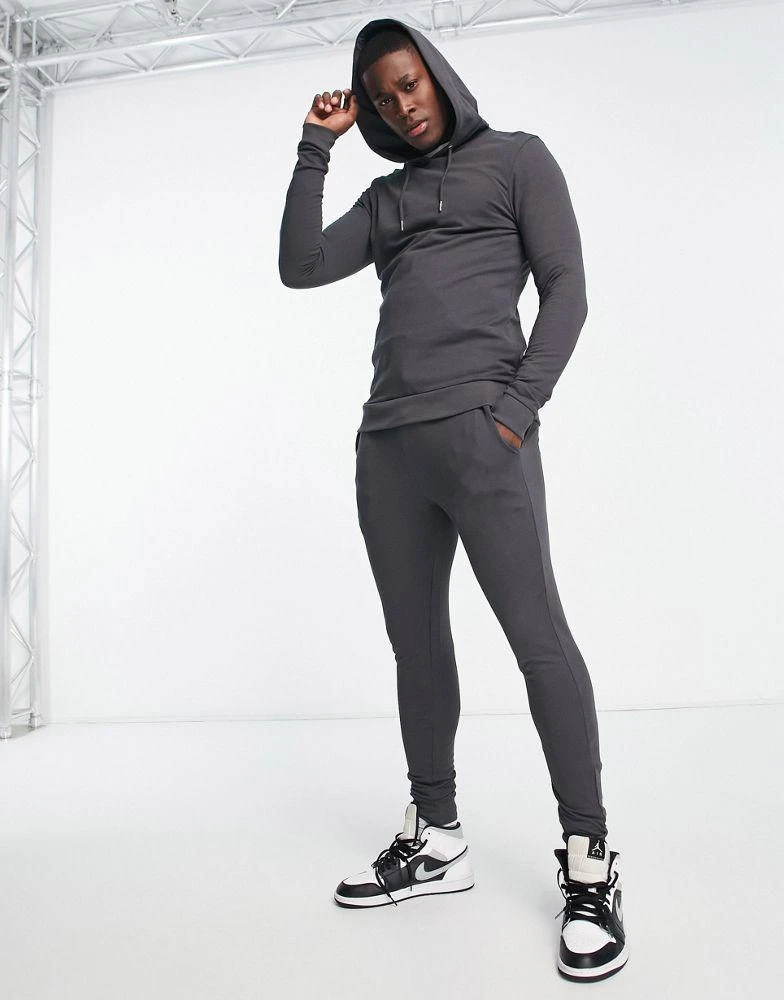 商品ASOS|ASOS DESIGN muscle hoodie with super skinny joggers tracksuit in washed black,价格¥209,第1张图片