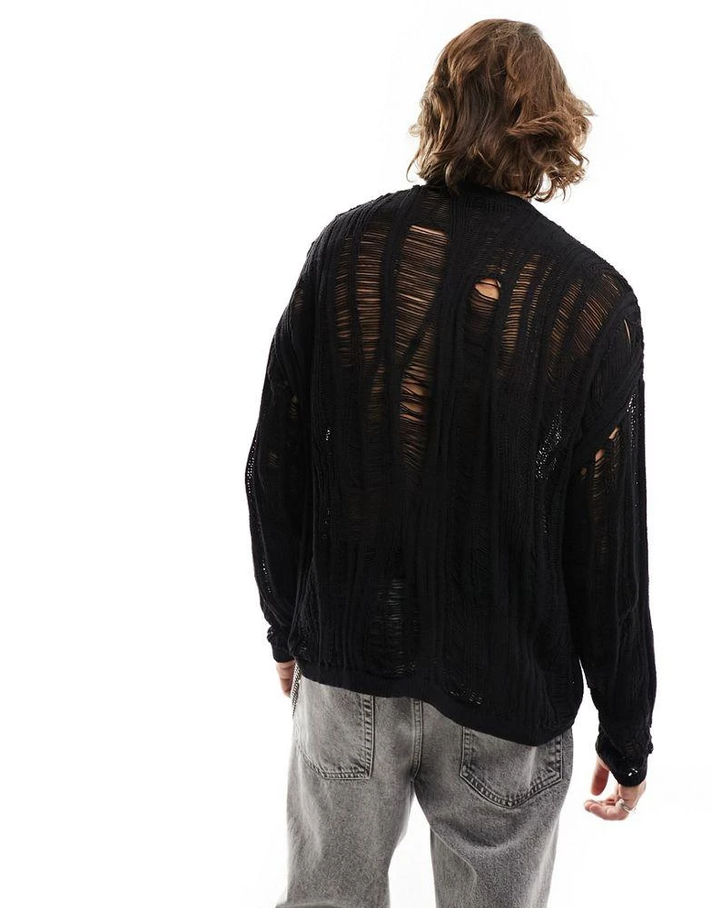 商品ASOS|ASOS DESIGN knitted oversized jumper with distressed ladder detail in black,价格¥186,第2张图片详细描述