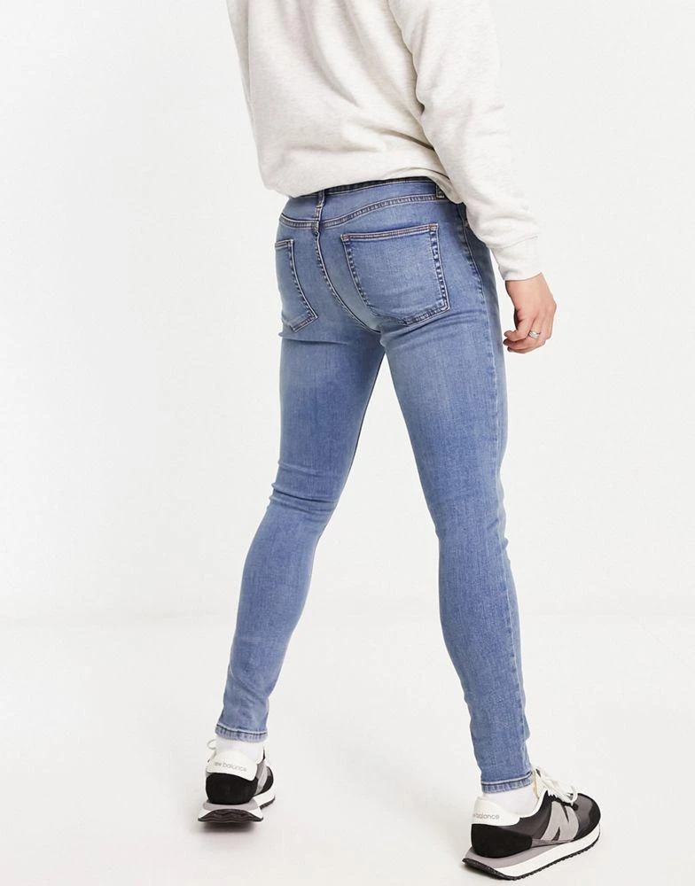 商品ASOS|ASOS DESIGN power stretch jeans in light wash blue,价格¥109,第4张图片详细描述