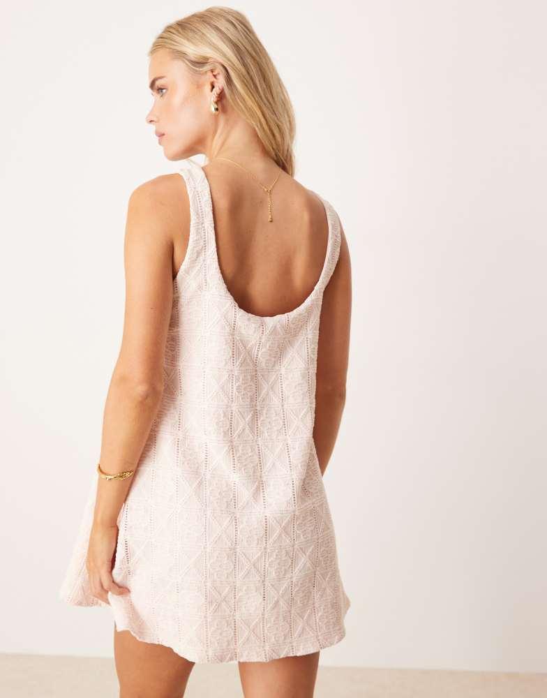 asos design tiered trapeze mini dress in broderie ASOS Design Petite Embroidery Trapeze Mini Dress in baby pink-Neutral