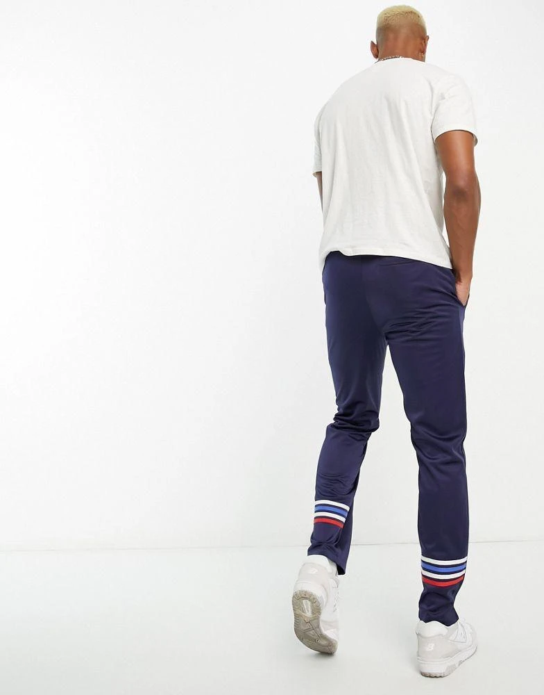 商品Sergio Tacchini|Sergio Tacchini Varena track pants with side stripe in navy,价格¥327,第2张图片详细描述