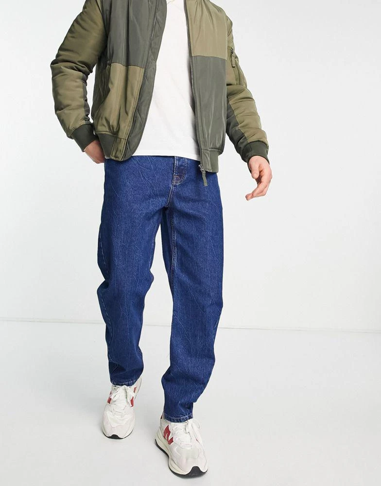 商品Topman|Topman curved leg tapered jeans in indigo,价格¥211,第1张图片