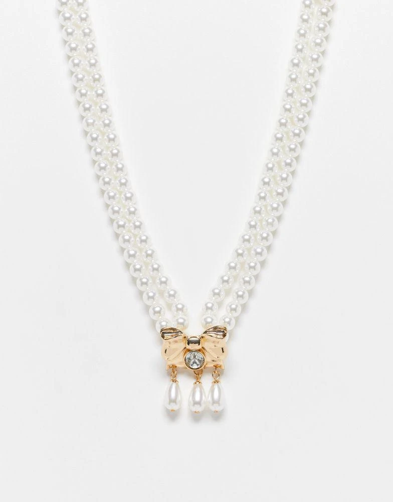 商品Reclaimed Vintage|Reclaimed Vintage pearl necklace with bow drop in gold,价格¥107,第1张图片