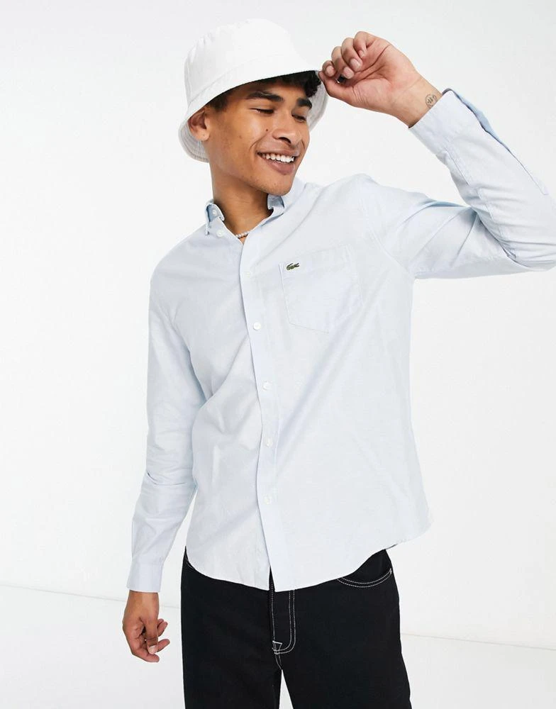 商品Lacoste|Lacoste oxford long sleeve shirt in light blue,价格¥516,第1张图片