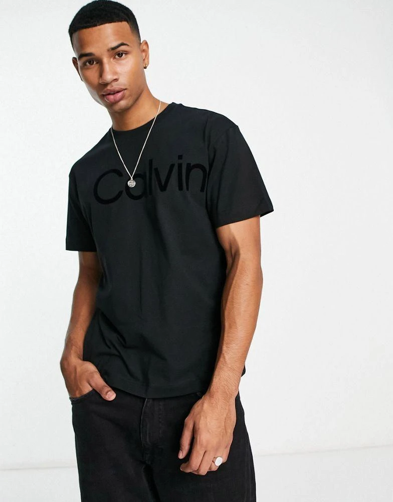 商品Calvin Klein|Calvin Klein large flock logo comfort cotton t-shirt in black,价格¥585,第2张图片详细描述