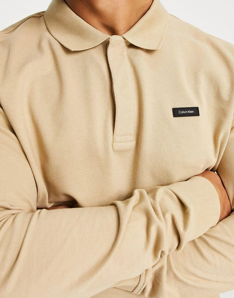 商品Calvin Klein|Calvin Klein long sleeve pique polo in beige,价格¥479,第3张图片详细描述